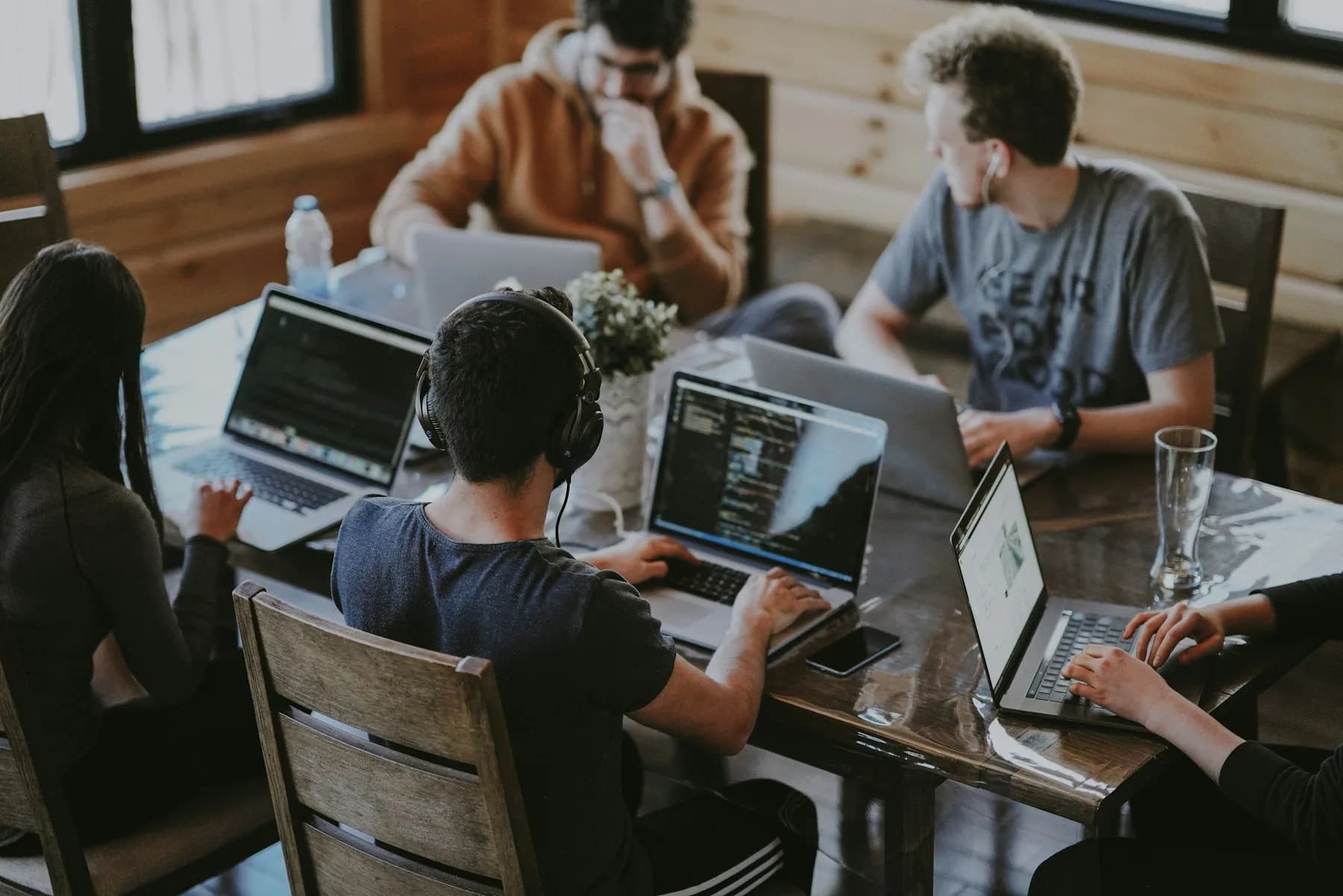 Colleagues working together around a shared table